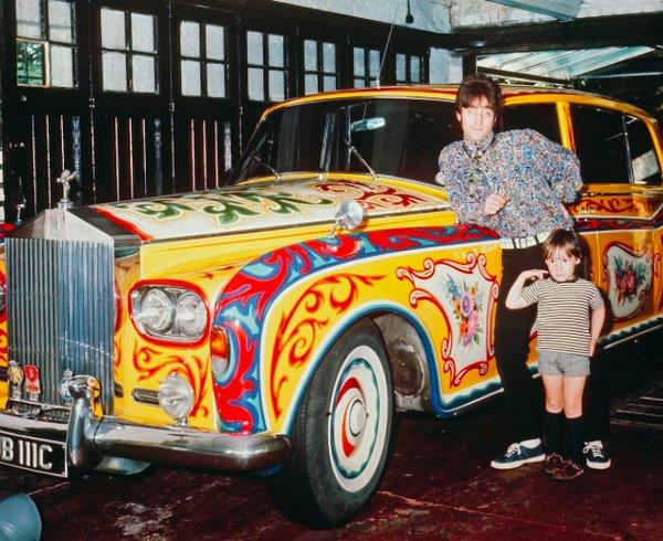 John Lennon and son pose beside his psychedelic Rolls Royce, 1967